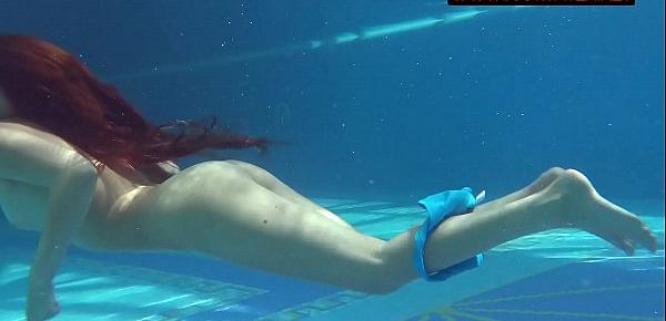  Small teen Mia Ferrari strips naked in pool